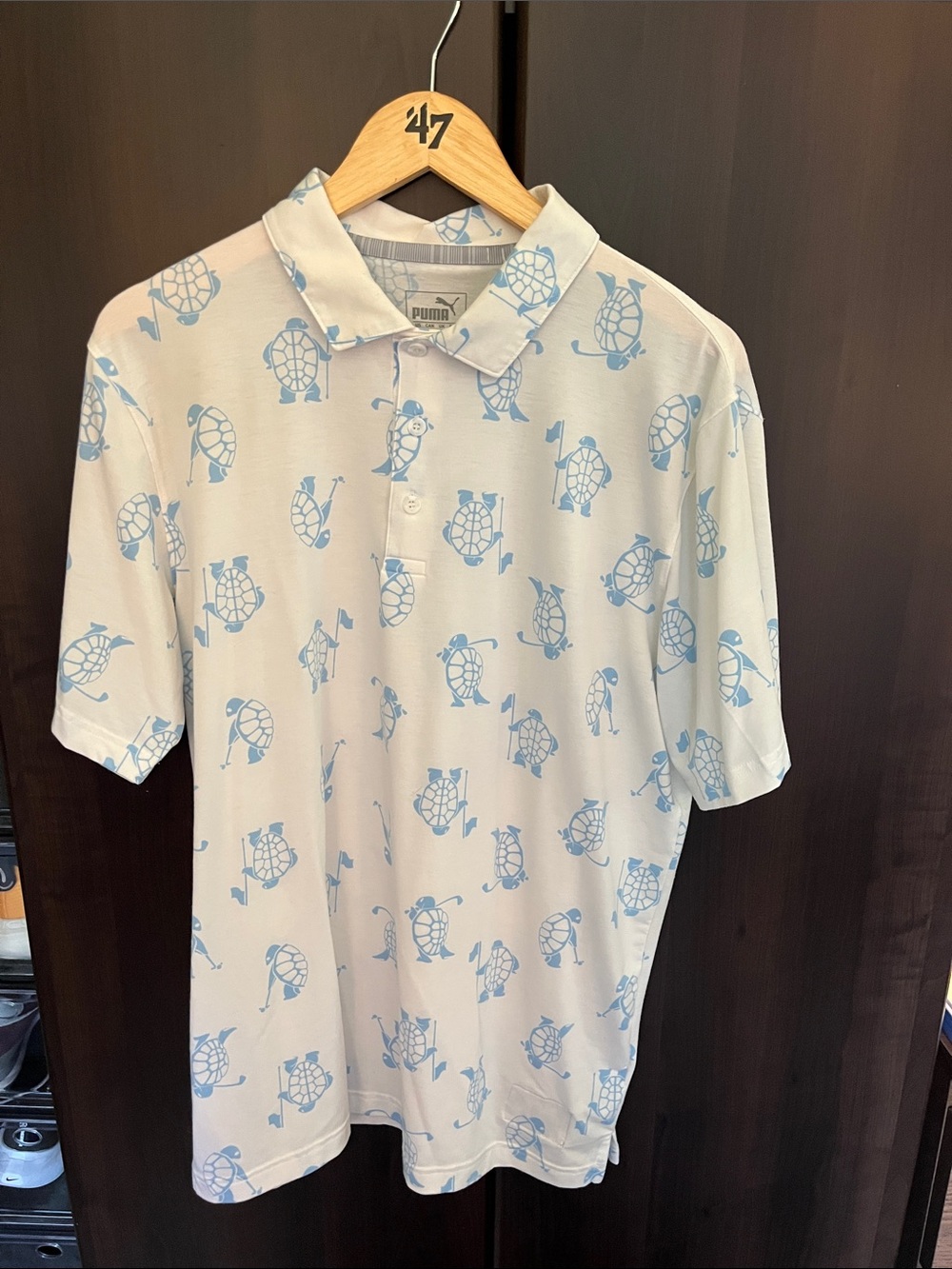 Puma Men’s White Polo with Light Blue Turtle Print